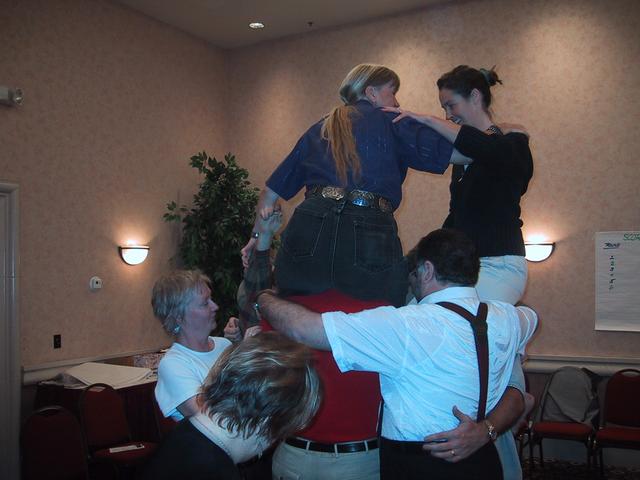 Sue and Deirdre on the shoulders of Vadim and others, Becky and Esther watching